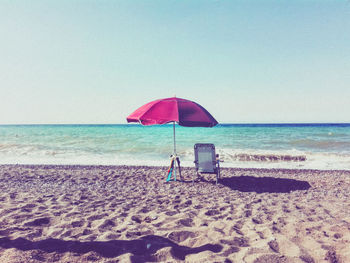 Scenic view of beach against clear sky