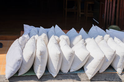 Close-up of umbrellas on table against building