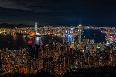 High angle view of illuminated buildings in city at night