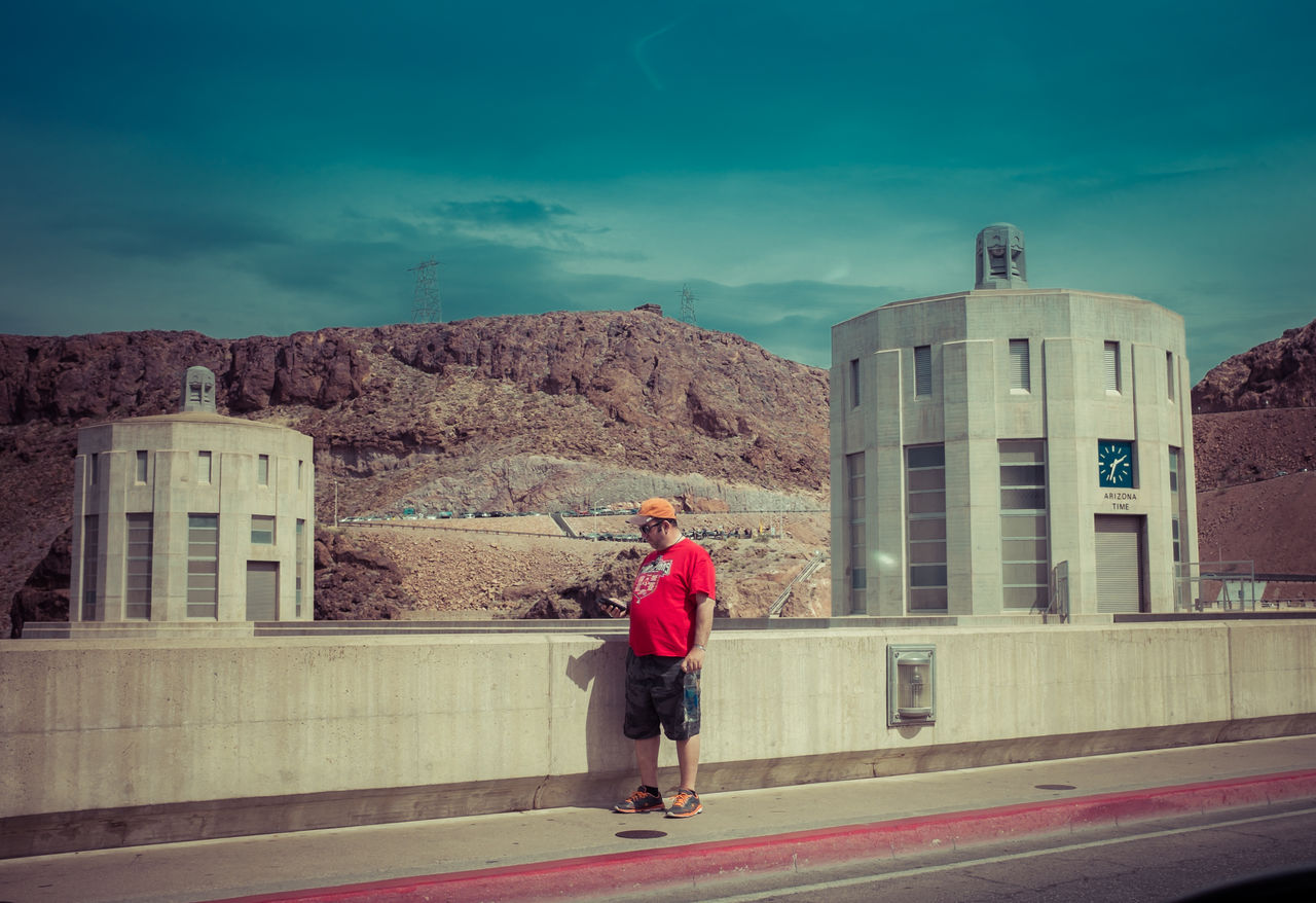 WOMAN STANDING ON CITY STREET