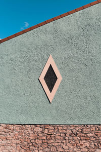 Low angle view of wall against sky