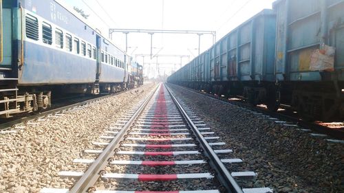 Train at railroad station against sky