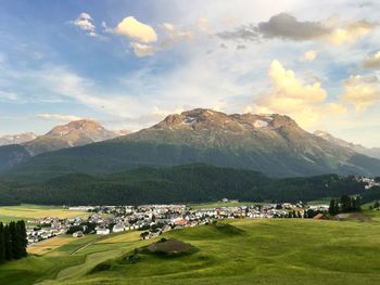 Scenic view of landscape against cloudy sky