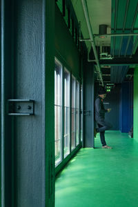 Full length of man standing in building