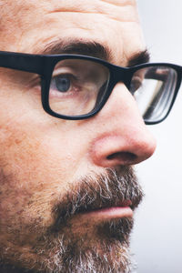 Close-up portrait of man wearing eyeglasses