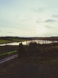 Scenic view of lake against sky during sunset