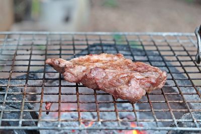 Close-up of meat on barbecue grill