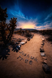 Scenic view of land against sky at sunset