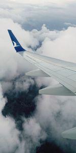 Aerial view of airplane flying in sky