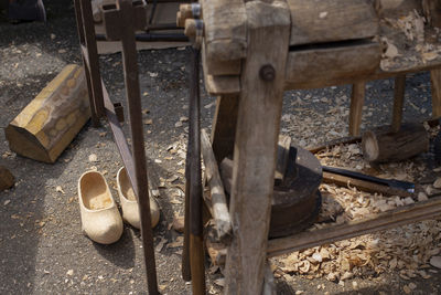 High angle view of old shoes on wood