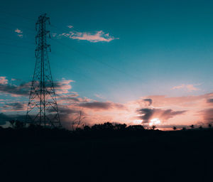 Silhouette trees against sky during sunset