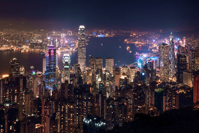 High angle view of illuminated city buildings at night