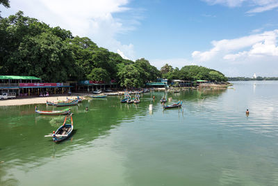 Boats in lake against sky