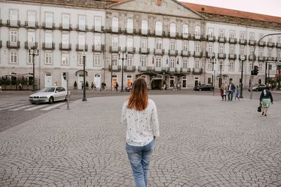 Rear view of woman walking outdoors