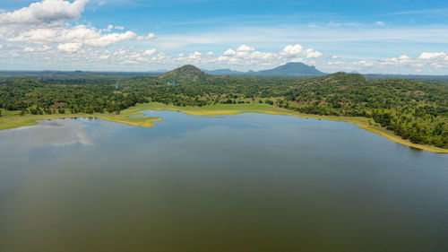  tropical landscape with lake and valley with tropical forest. sorabora lake, sri lanka.