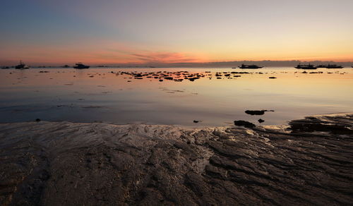 Scenic view of sea against sky during sunset