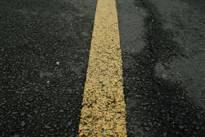 High angle view of arrow sign on road