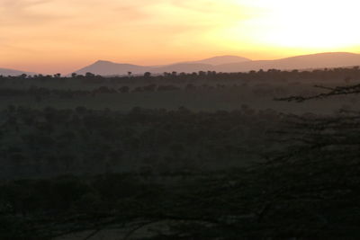 Scenic view of landscape against sky during sunset