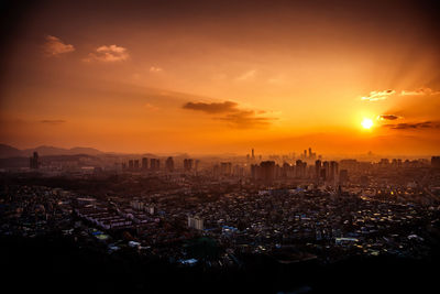 High angle view of city at sunset