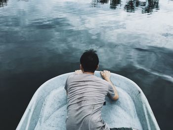 Rear view of a man in lake