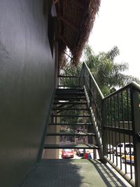 Staircase amidst trees against sky