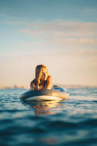 Portrait of woman swimming in sea