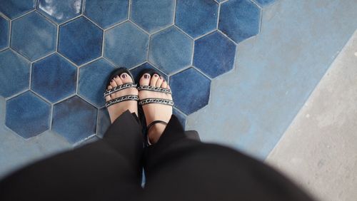 Low section of woman standing on floor