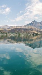 Scenic view of lake and mountains against sky