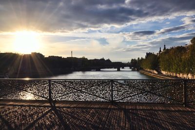 Scenic view of river against sky during sunset