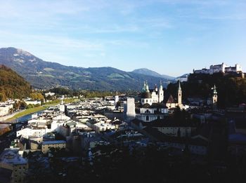 High angle view of townscape against mountain range