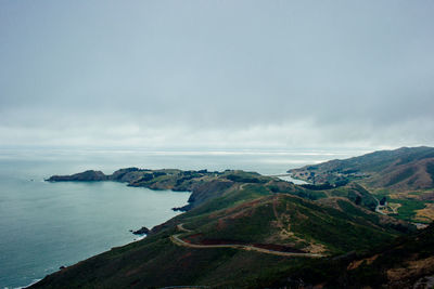 Scenic view of sea against cloudy sky