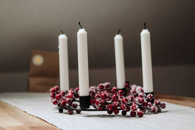 Close-up of candles on table