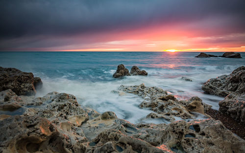 Scenic view of sea against sky during sunset