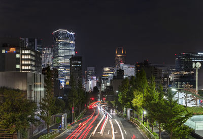 Traffic cars headlights at night on the fire street leading from harajuku to shibuya.