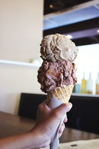 Close-up of woman holding ice cream cone