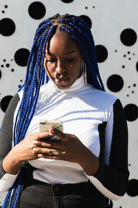 Young woman using mobile phone