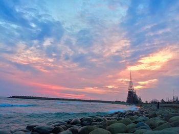 Scenic view of sea against sky at sunset