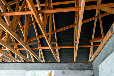 Roof trusses covered with a membrane on a detached house under construction, visible roof elements