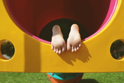 Low section of boy on play equipment