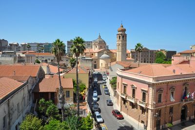 High angle view of buildings in city against clear sky