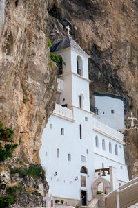 Low angle view of buildings against mountain