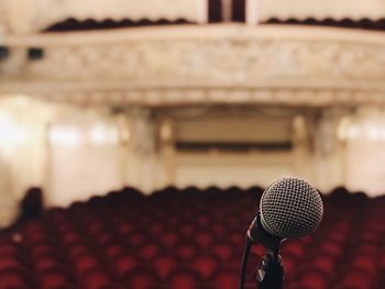 Close-up of microphone in auditorium