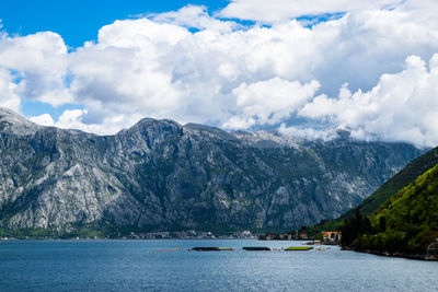 Scenic view of lake against cloudy sky