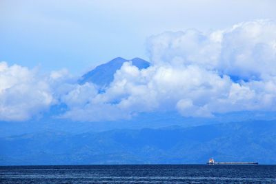 Scenic view of sea against cloudy sky