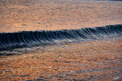 Sea waves splashing on land