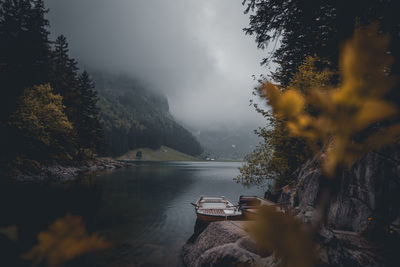 Scenic view of lake by trees against sky during autumn