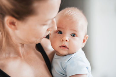 Close-up of cute baby boy at home