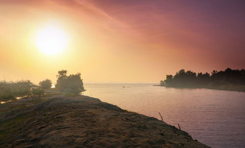 Scenic view of sea against sky during sunset