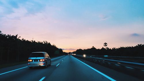 Road passing through dramatic sky