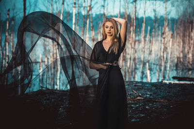 Young woman standing in park